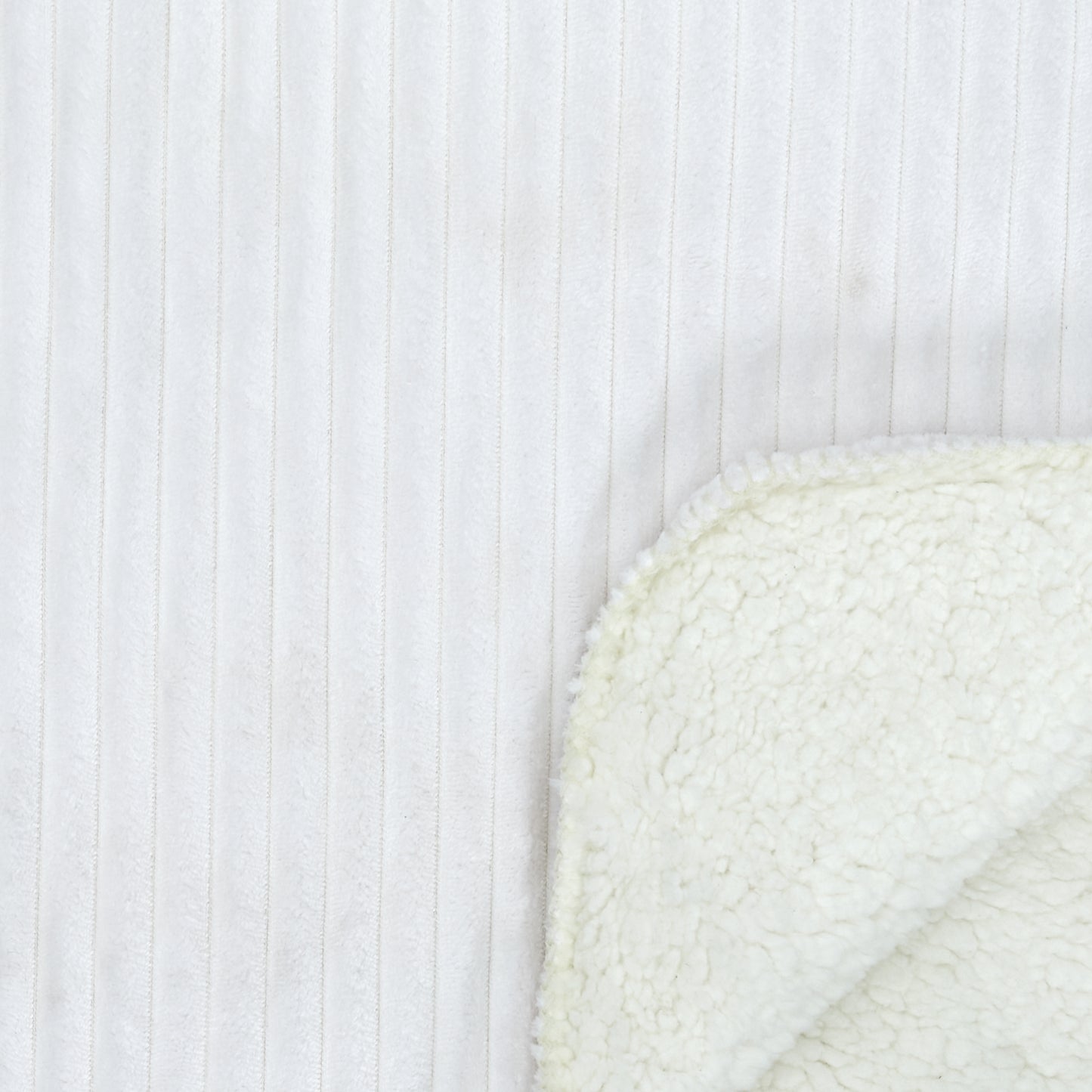 Détail de la flanelle côtelée et du Sherpa écru du plaid ZenPur, texture moelleuse et chaleureuse